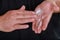 Cosmetician man hand with cream on hands