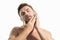 Cosmetics, body care and spa treatment. Portrait of masculinity charming shirtless man  over white background