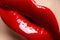 Cosmetics. Fashion bright red lips glossy make-up