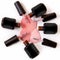 Cosmetics for hand care.Nail gel lying on a white surface. Spilled lacquers on a white background in black bottles