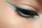 Cosmetics, macro eye make-up. Fashion mint liner eyeshadows