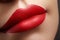 Cosmetics, makeup. Bright lipstick on lips. Closeup of beautiful female mouth with red and pink lip makeup. Part of face