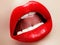 Cosmetics and makeup. Red lip gloss and lipstick. Fashion lip makeup. Sensual female mouth