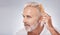 Cosmetics, senior man and brush hair for grooming, treatment and on grey studio background. Mature male, elderly guy and