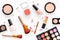 Cosmetics set with beige and nude tones for natural makeup on white background top view