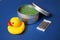 Cosmetics set: rubber duck, body scrub in a jar, bamboo cotton sticks