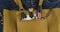 Cosmetics sticking out of the pocket of a yellow bag. Rotation. Cosmetic background.