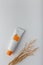 Cosmetics tube mockup template. Cream with sea buckthorn extract, face skin care. Container with no brand orange label on white