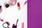 Cosmetics on white and violet background