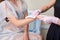 A cosmetologist checks the results of a laser hair removal procedure.