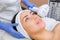 The cosmetologist makes the procedure Cryotherapy of the facial skin