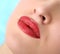 Cosmetologist making permanent makeup on woman\'s face