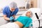 Cosmetologist performing female body ultrasound cavitation