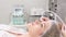 A cosmetologist performs a diamond dermabrasion facial polishing procedure. 4k video