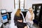 Cosmetologist talking to a patient woman, in modern spa clinic. Choosing the procedure. Portrait of attractive lady in