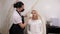 A cosmetologist wipes the eyebrows with cotton swabs after a permanent makeup.