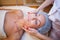 Cosmetology doctor makes woman treatments facial massage