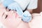 Cosmetology and facials. Mechanical removal of the cleaning of an adult woman`s face in the cosmetics office is a