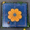Cosmic Symbolism in Orange Flower and Square on Blue Canvas (AI Generated)