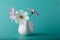 Cosmos flower milk jug on aqua color background