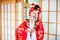 Cosplay. beautiful, modest geisha in a red kimono