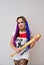 Cosplayer girl with a baseball bat in Harley Quinn costume