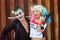 Cosplayer girl in Harley Quinn costume and man in Joker costume