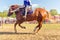 A Cossack girl rides a horse and performs tricks