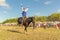 A Cossack girl rides a horse and performs tricks