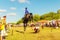 A Cossack girl rides a horse and performs tricks