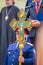 A Cossack officer holds a sacred large cross in his hands