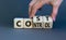 Cost control symbol. Businessman turns wooden cubes and changes the concept word Cost to Control. Beautiful grey table grey