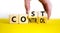 Cost control symbol. Businessman turns wooden cubes and changes the concept word Cost to Control. Beautiful yellow table white