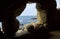 Costa brava beach view through a cave hole