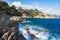 Costa Brava seascape. Rocks in sea beach in Lloret de Mar, Spain. Spanish rocky coast