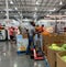 Costco staff wearing mask and refiling the pumpkin