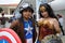 Costumers roleplaying Captain America and Wonder woman