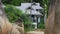 Cosy bungalow, small house cottage, palm tree background