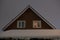 Cosy house with pitched roof in winter