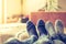 Cosy relaxing in the wintertime at home: Couple with woollen socks is lying on the couch