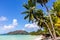 Cote D`Or Beach Anse Volbert on Praslin Island, beautiful tropical sandy beach with lush coconut palm trees, Seychelles