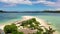 Cotivas Island Cottage. Tropical island with palm trees and a white sandy beach. Caramoan Islands, Philippines.