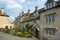 Cotswold stone houses line the streets in Painswick, Gloucestershire, UK