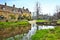 Cotswolds village of Lower Slaughter with morning reflections, England