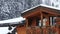 Cottage balcony under snowfall attic wooden mountain accommodation snow forest background