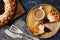 Cottage cheese cake with berry jam and coffee on a dark blue background. Top view, flat lying