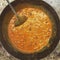 Cottage cheese curry being cooked in an Indian kitchen