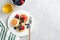 Cottage cheese fritters with berries and honey on plate