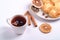 Cottage cheese fritters with hot black aromatic tea, Christmas breakfast mood with anise and cinnamon on white background