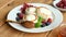 Cottage cheese fritters Syrniki with berries, honey and sour cream